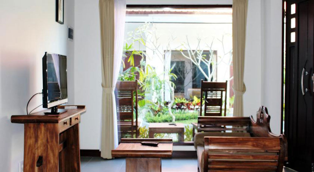 8.-La-Place-bright-and-spacious-tv-longue-within-room-by-booking.com