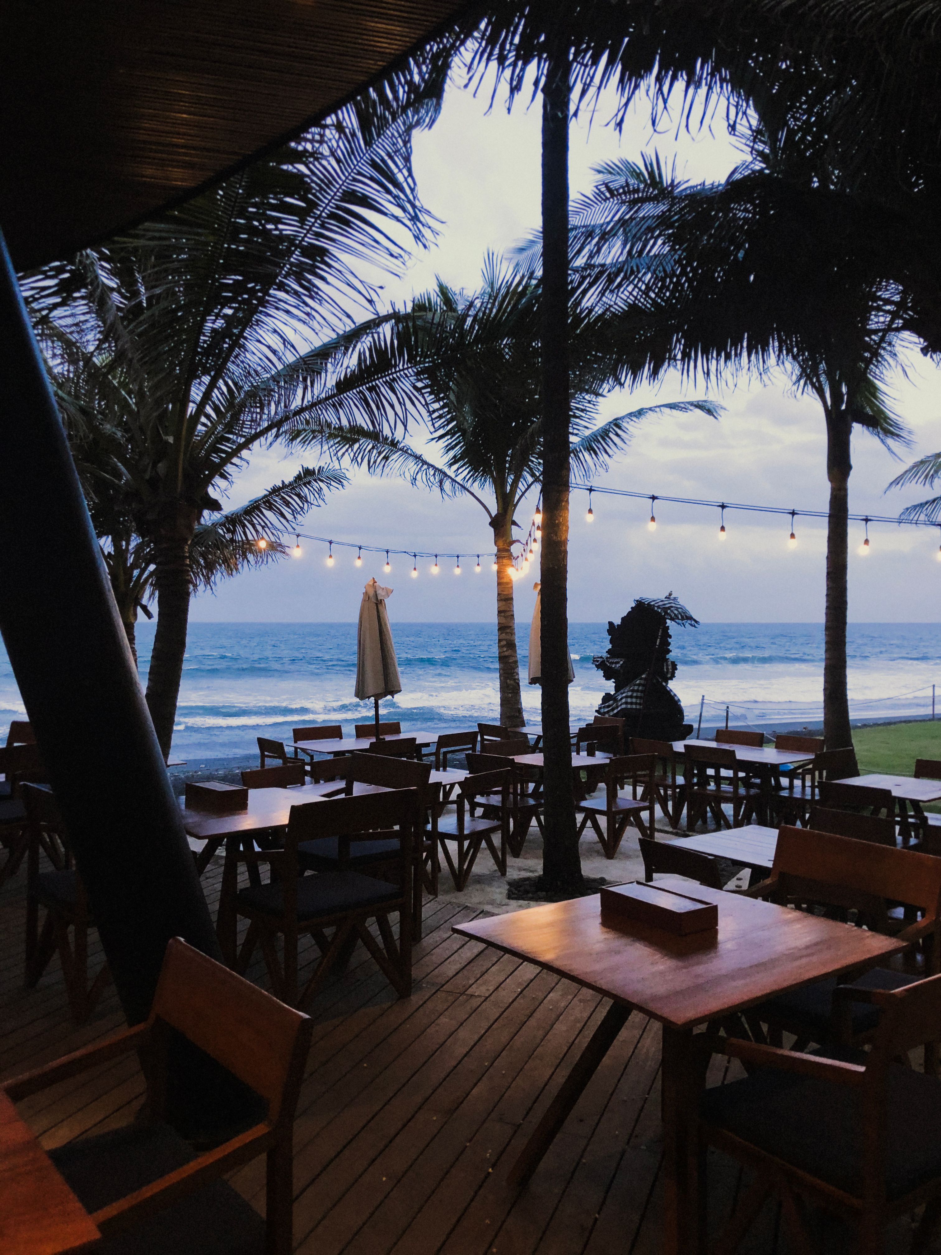 Beachfront dining table set up in Bali for a private celebration
